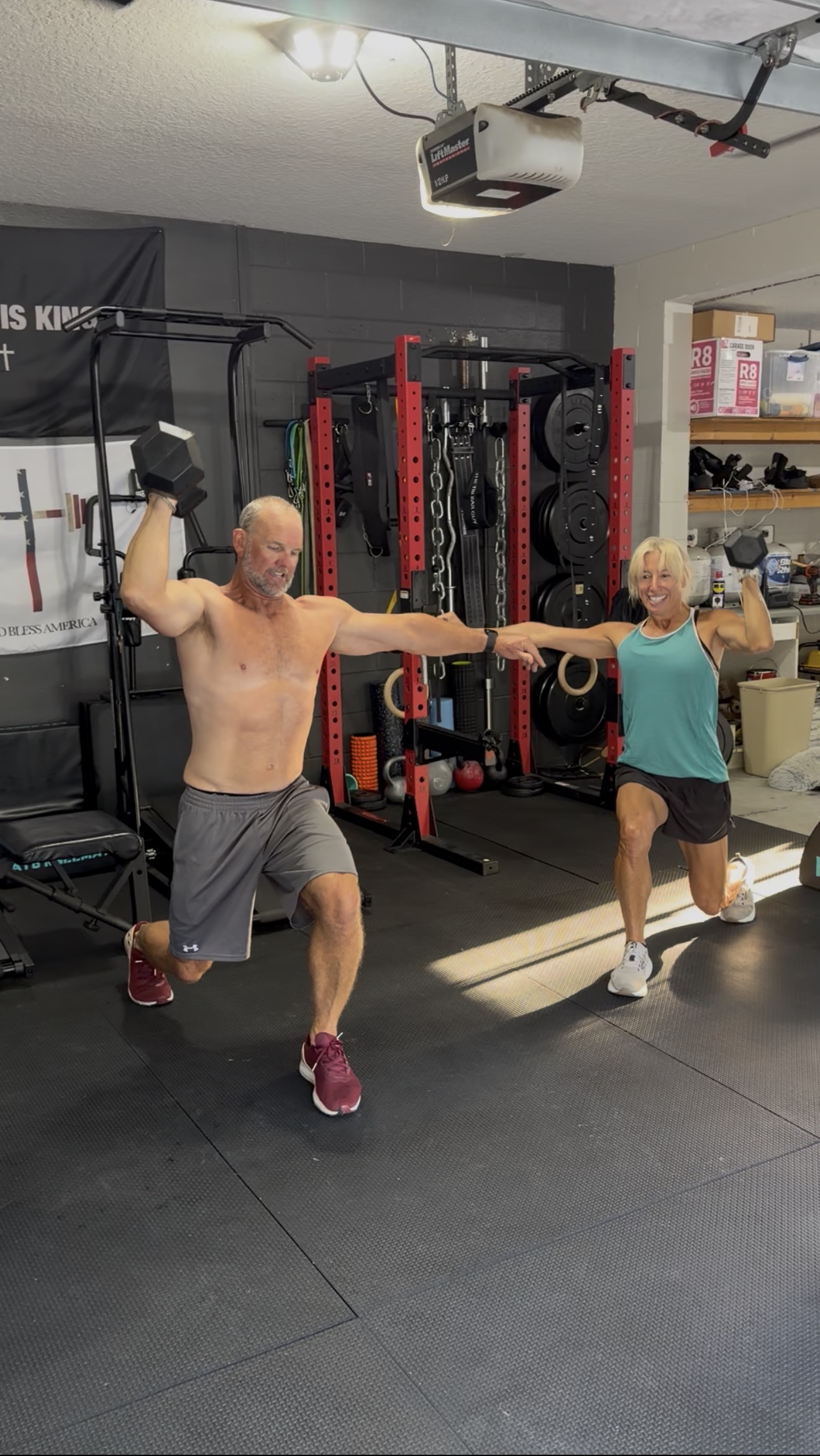 A couple enjoying a challenging movement together during their workout